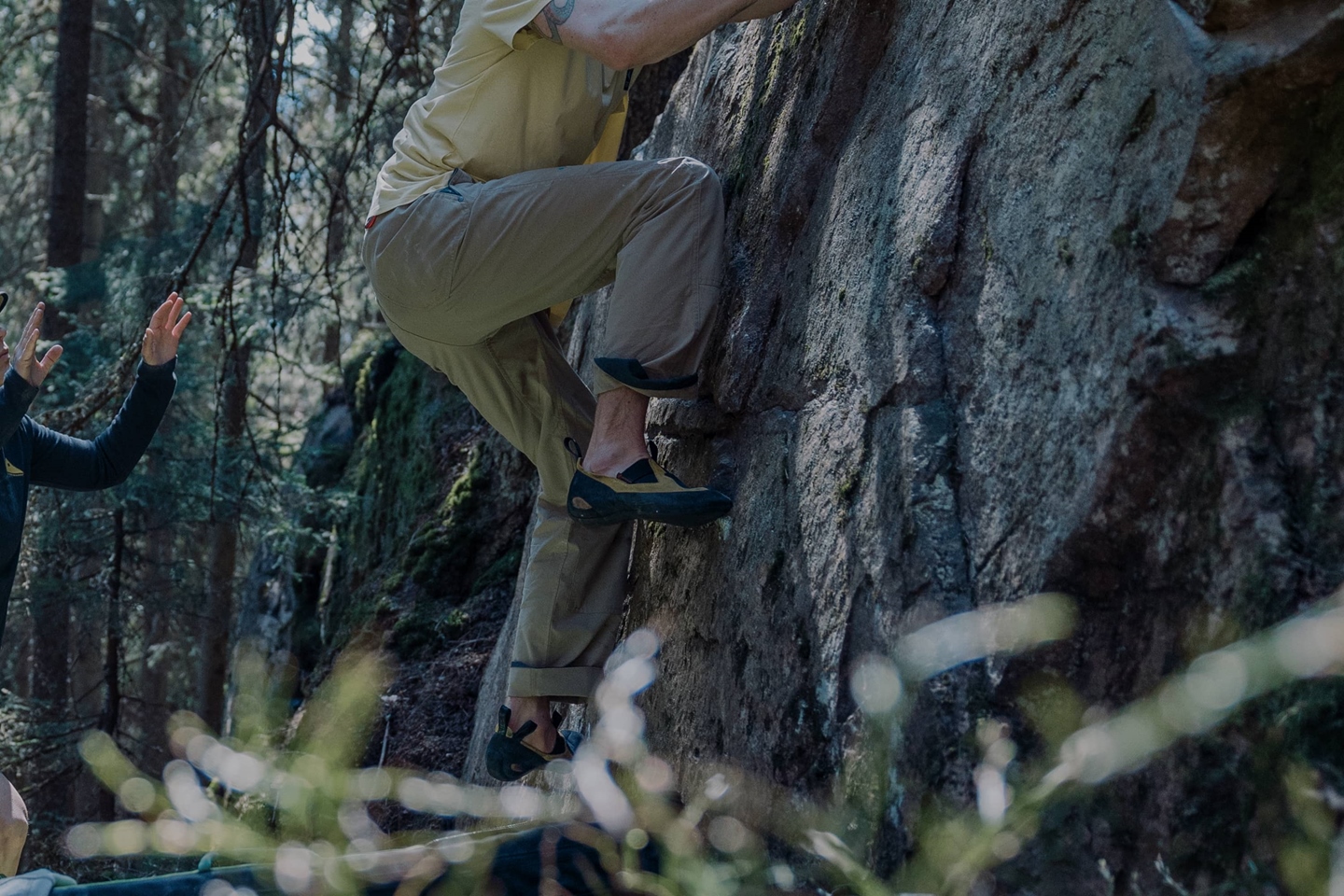 Male bouldering in the nature