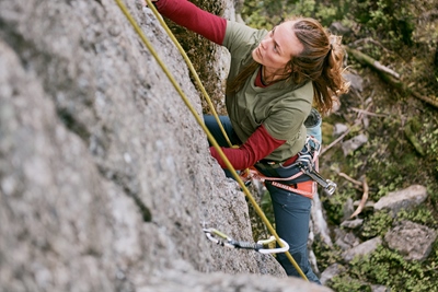 Close-up of woman rock climbing